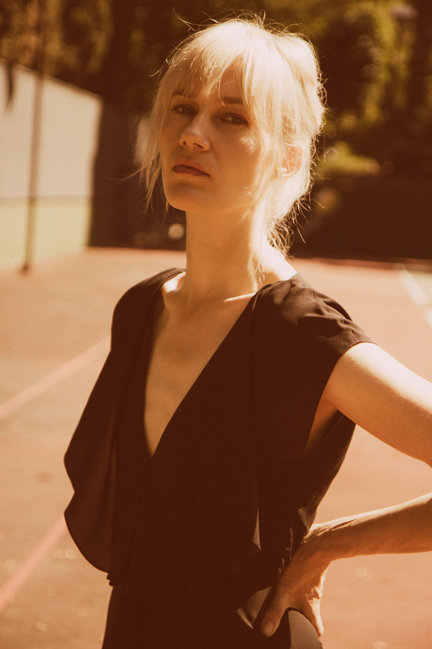 Model Tara Dupuis photographed by Brandon Mieske. Color photo of Tara wearing a black dress.