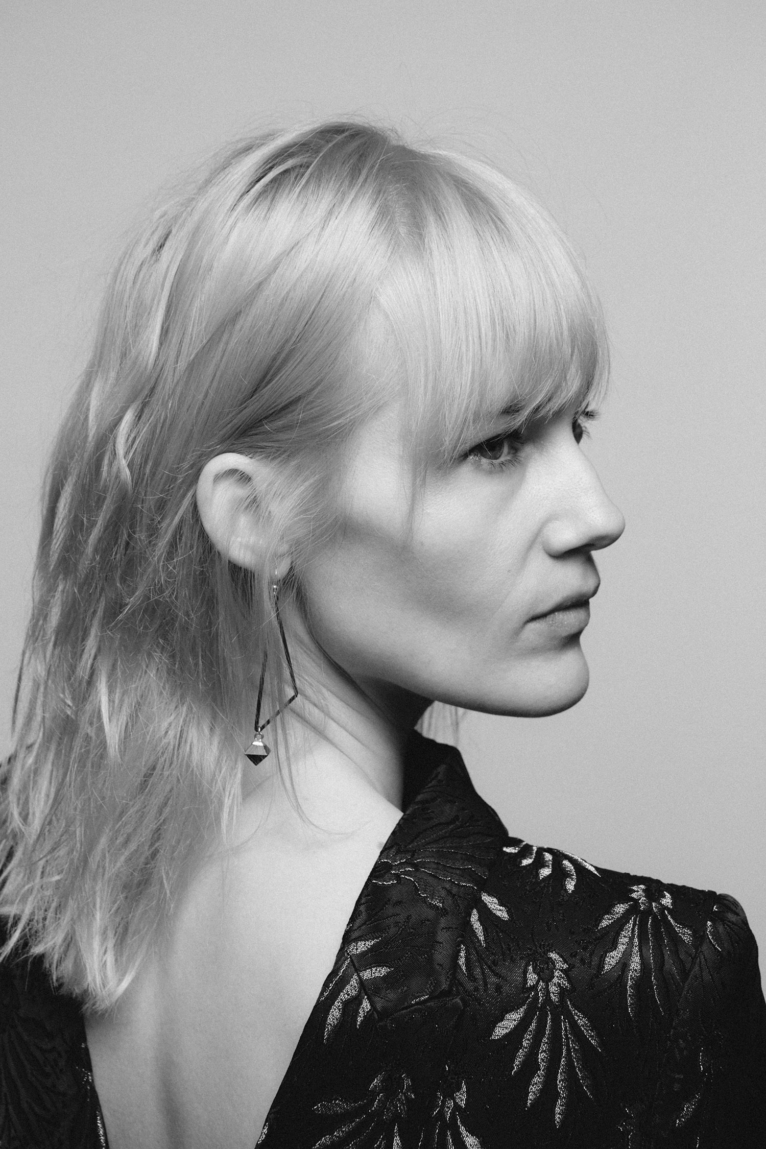 Model Tara Dupuis photographed by Brandon Mieske. Black and white close up photo.